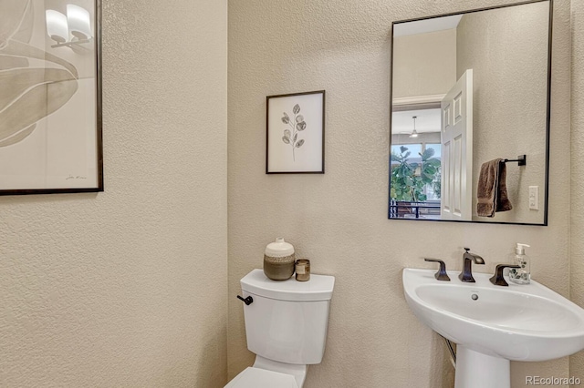 bathroom with sink and toilet