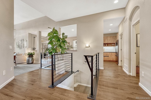 stairway featuring wood-type flooring