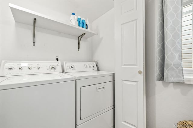 laundry room featuring separate washer and dryer