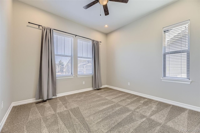 empty room with ceiling fan, baseboards, carpet flooring, and recessed lighting