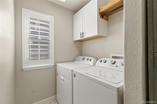 laundry room featuring cabinet space, independent washer and dryer, and baseboards