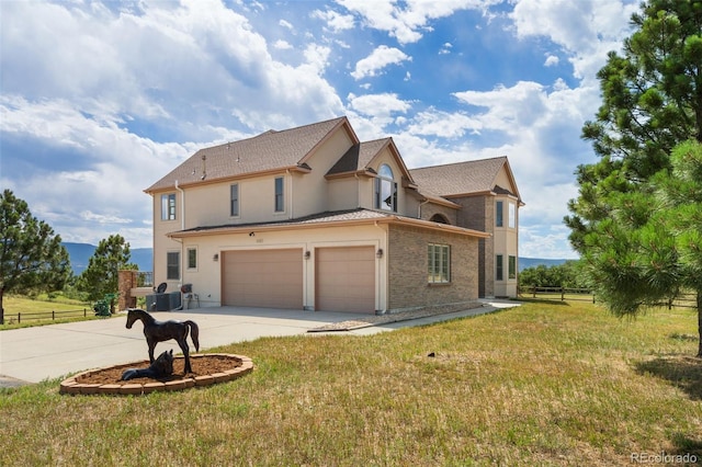 1680 Elk View Rd, Larkspur, CO 80118 - view of side of home featuring an attached garage, driveway, and stucco siding