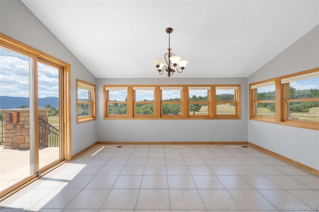 1680 Elk View Rd, Larkspur, CO 80118 - unfurnished dining area with vaulted ceiling, healthy amount of natural light, a chandelier, a mountain view, and light tile patterned floors