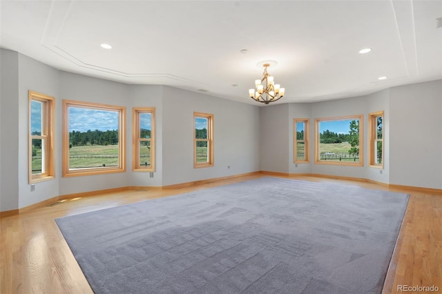 1680 Elk View Rd, Larkspur, CO 80118 - empty room featuring a chandelier, light wood-style flooring, and recessed lighting
