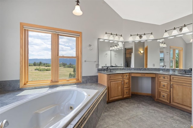 1680 Elk View Rd, Larkspur, CO 80118 - bathroom with lofted ceiling, double vanity, and a tub with jets