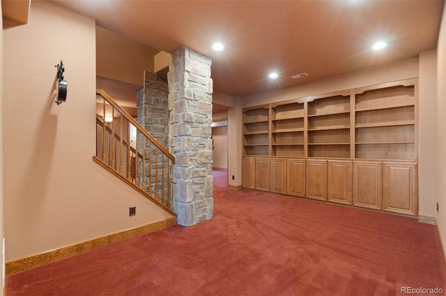 1680 Elk View Rd, Larkspur, CO 80118 - unfurnished living room with decorative columns, carpet floors, recessed lighting, and stairway