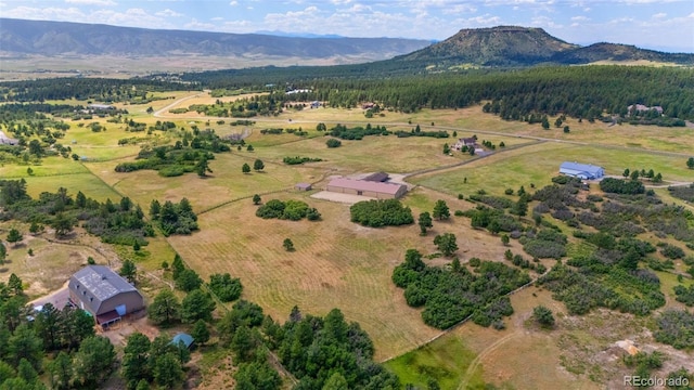 1680 Elk View Rd, Larkspur, CO 80118 - aerial overview of property's location featuring a mountain backdrop and rural landscape