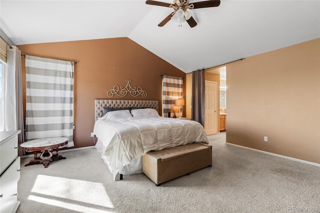 bedroom featuring lofted ceiling, light carpet, and baseboards