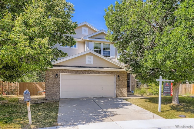 13277 Elizabeth St, Thornton, CO 80241 - view of front facade with concrete driveway and brick siding