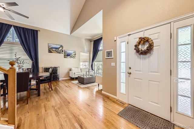 13277 Elizabeth St, Thornton, CO 80241 - foyer with light wood-type flooring, a ceiling fan, plenty of natural light, and high vaulted ceiling