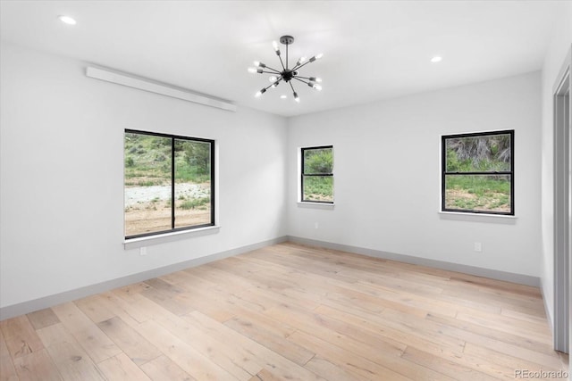 7916 Cozart Ln, Salida, CO 81201 - unfurnished room with healthy amount of natural light, a chandelier, recessed lighting, and light wood finished floors