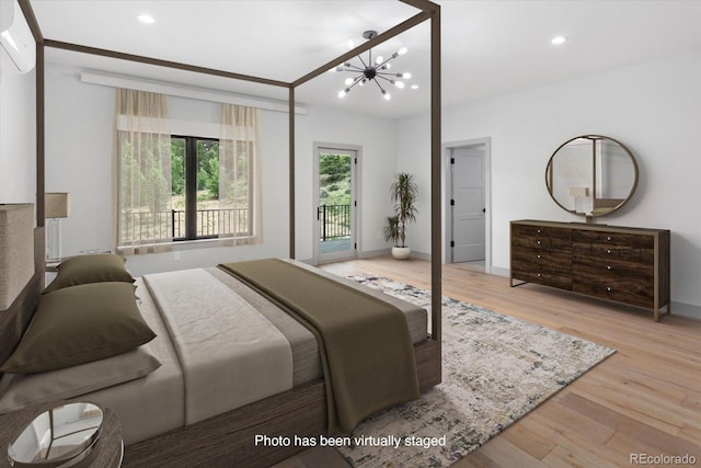 7916 Cozart Ln, Salida, CO 81201 - bedroom with access to exterior, wood finished floors, a chandelier, and recessed lighting