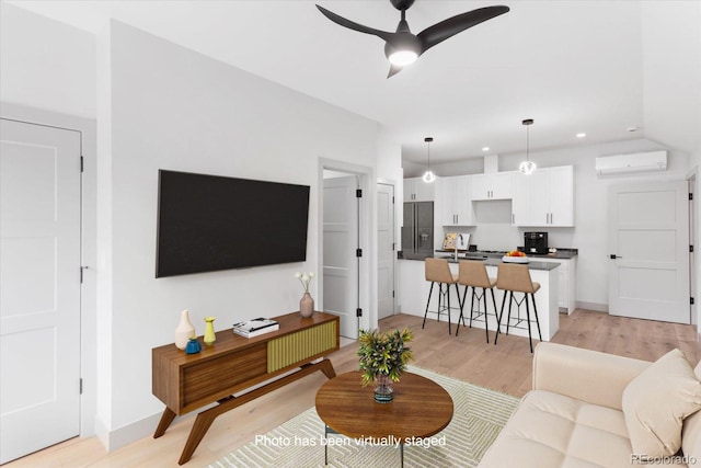 7916 Cozart Ln, Salida, CO 81201 - living area with a wall unit AC, ceiling fan, light wood-style floors, and recessed lighting