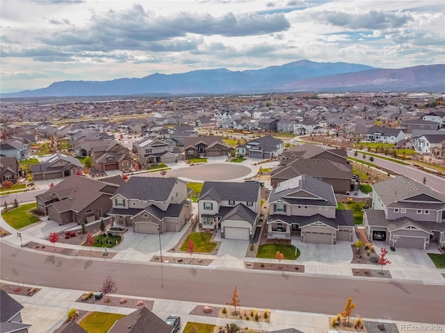 birds eye view of property featuring a mountain view