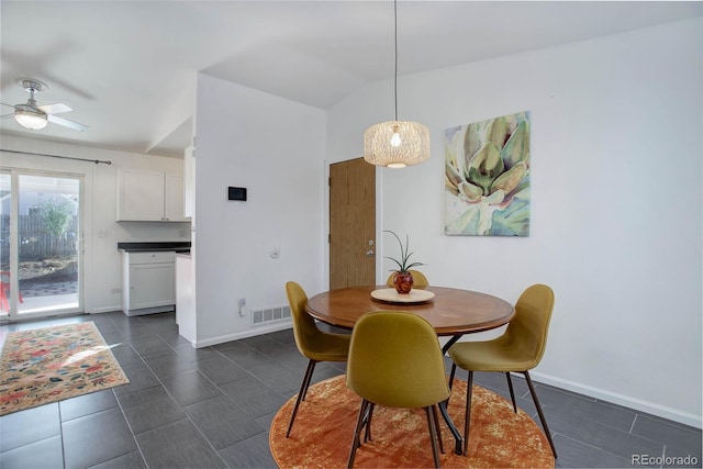 dining room with a ceiling fan, visible vents, and baseboards