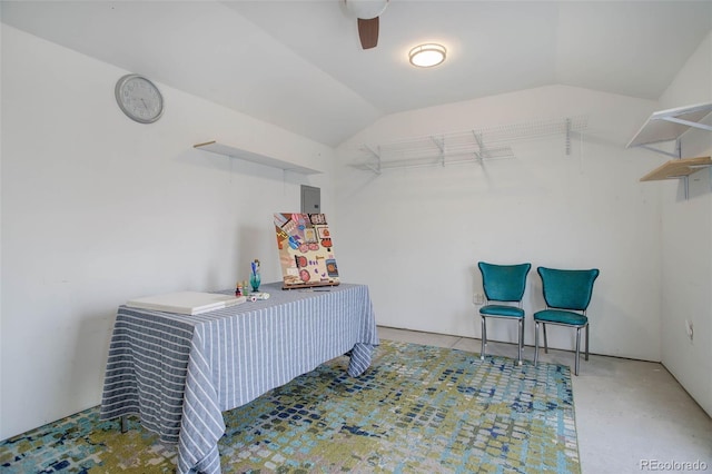 interior space featuring lofted ceiling and a ceiling fan