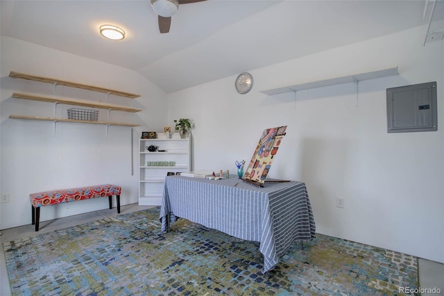 bedroom featuring lofted ceiling and electric panel