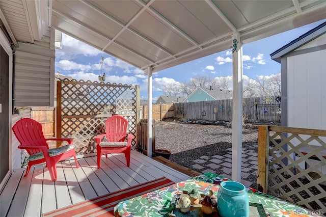 deck with a fenced backyard