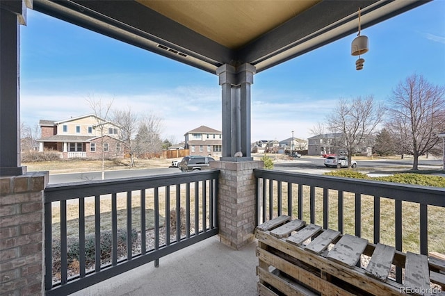 balcony featuring a residential view and a porch