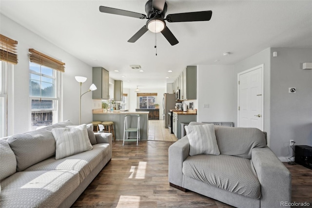 living room featuring recessed lighting, wood finished floors, and ceiling fan