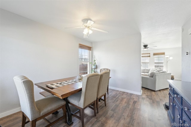 dining space with wood finished floors, baseboards, and ceiling fan