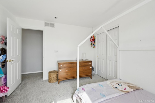 bedroom with visible vents, a closet, and carpet floors