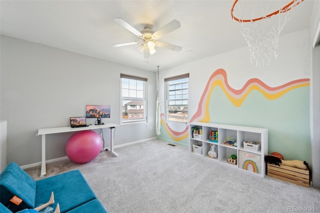 playroom with visible vents, carpet floors, baseboards, and ceiling fan