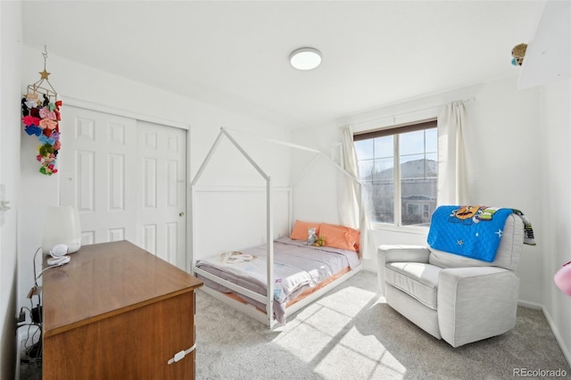 bedroom featuring a closet and carpet