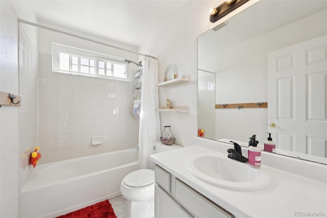 bathroom featuring visible vents, toilet, shower / bath combo, and vanity