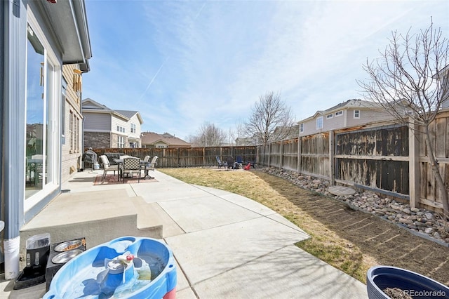 view of patio / terrace featuring outdoor dining area and a fenced backyard