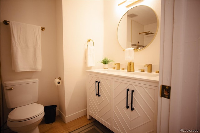 1552 S Fairplay Way, Aurora, CO 80012 - full bathroom featuring double vanity and wood finished floors