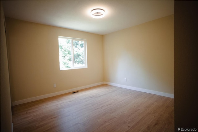 1552 S Fairplay Way, Aurora, CO 80012 - empty room featuring wood finished floors and baseboards