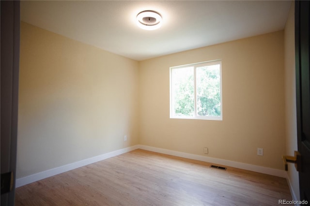 1552 S Fairplay Way, Aurora, CO 80012 - spare room with wood finished floors and baseboards