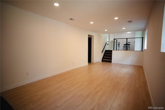 1552 S Fairplay Way, Aurora, CO 80012 - empty room featuring stairs, light wood finished floors, and recessed lighting