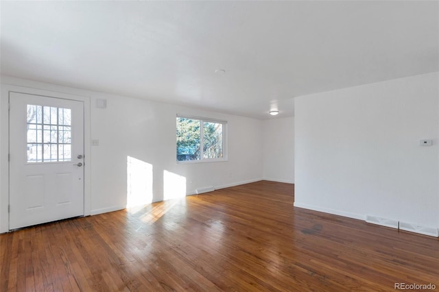 entrance foyer featuring dark hardwood / wood-style floors