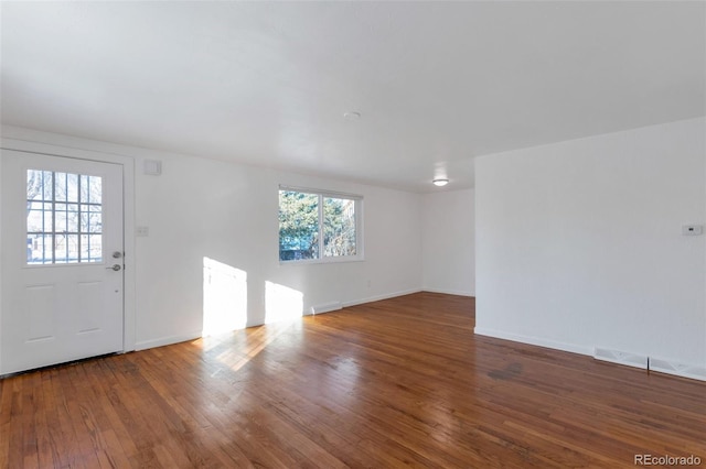 interior space with dark hardwood / wood-style flooring