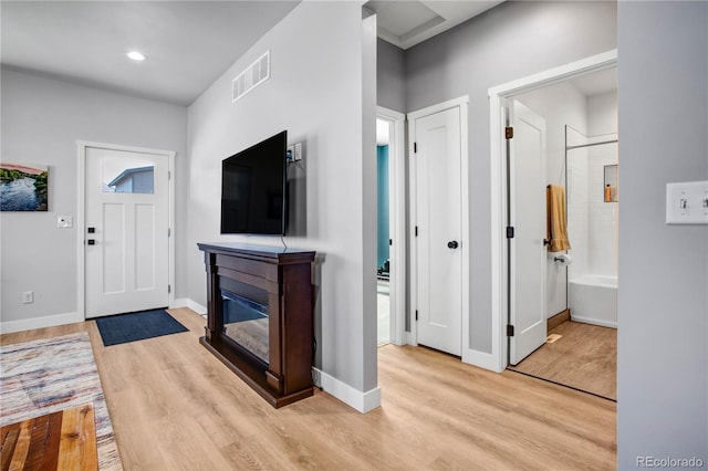 entryway with light hardwood / wood-style flooring