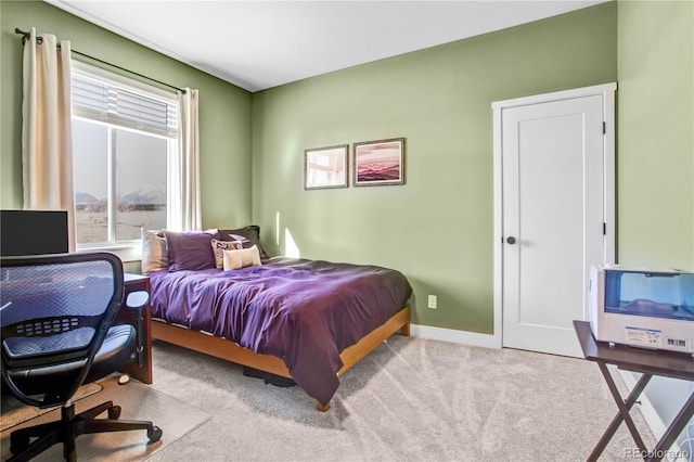 bedroom with light colored carpet