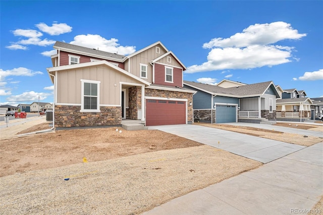20630 E 58th Ave, Aurora, CO 80019 - craftsman house featuring board and batten siding, stone siding, driveway, a residential view, and an attached garage