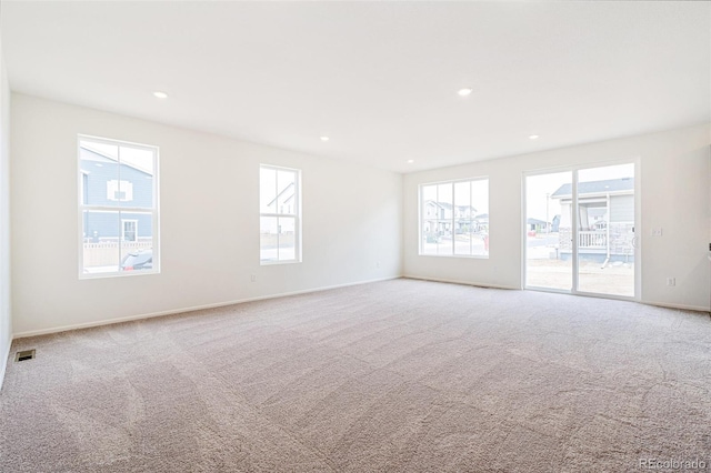 20630 E 58th Ave, Aurora, CO 80019 - carpeted spare room with plenty of natural light, baseboards, and recessed lighting