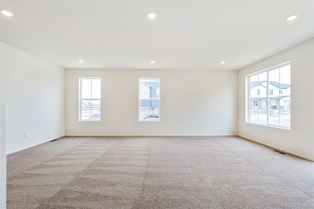 20630 E 58th Ave, Aurora, CO 80019 - spare room featuring light carpet, recessed lighting, and baseboards