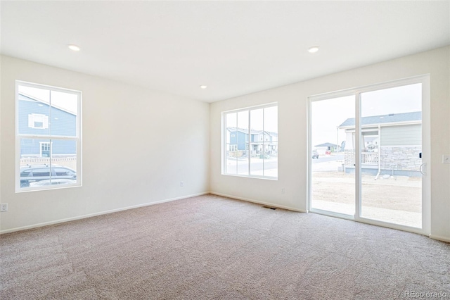 20630 E 58th Ave, Aurora, CO 80019 - spare room featuring carpet floors, baseboards, and recessed lighting
