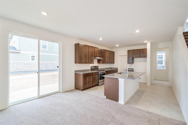 20630 E 58th Ave, Aurora, CO 80019 - kitchen featuring stainless steel range with gas stovetop, a sink, plenty of natural light, a kitchen island with sink, and recessed lighting