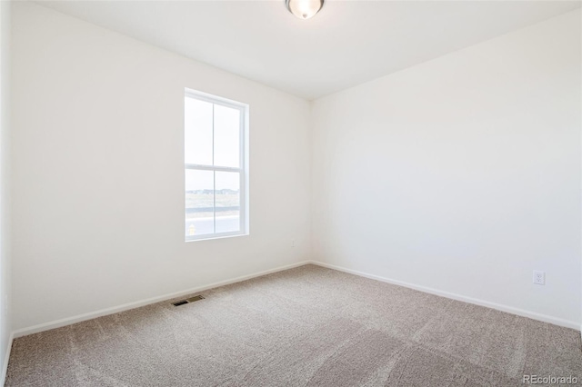 20630 E 58th Ave, Aurora, CO 80019 - spare room featuring carpet and baseboards