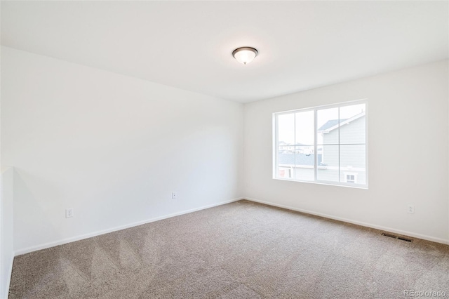 20630 E 58th Ave, Aurora, CO 80019 - carpeted spare room featuring baseboards