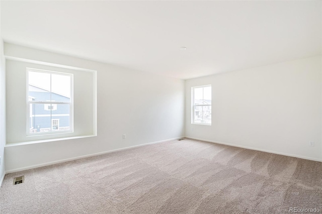 20630 E 58th Ave, Aurora, CO 80019 - spare room featuring carpet floors and baseboards