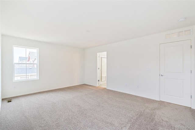20630 E 58th Ave, Aurora, CO 80019 - spare room featuring light carpet, baseboards, and a smoke detector
