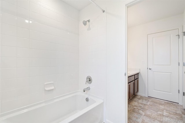 20630 E 58th Ave, Aurora, CO 80019 - bathroom with washtub / shower combination, vanity, and baseboards
