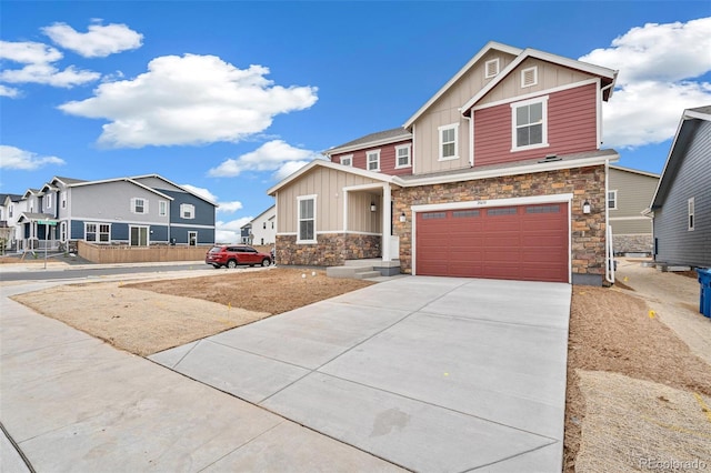 20630 E 58th Ave, Aurora, CO 80019 - craftsman house featuring board and batten siding, stone siding, an attached garage, driveway, and a residential view