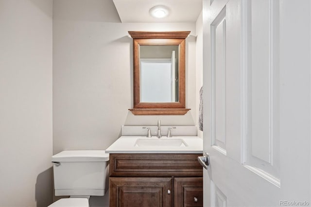 half bath with toilet and vanity